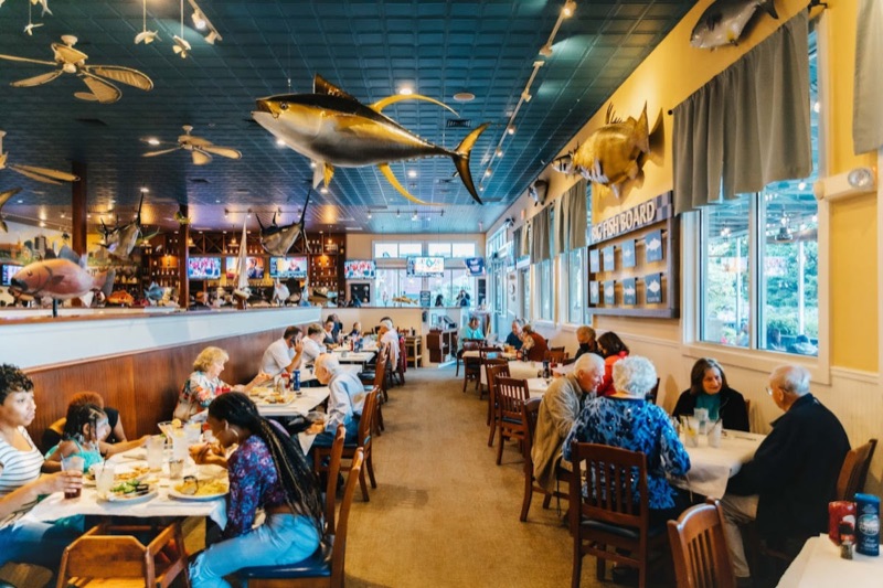 Big Fish Grill dining room with a mounted marlin and nautical decor